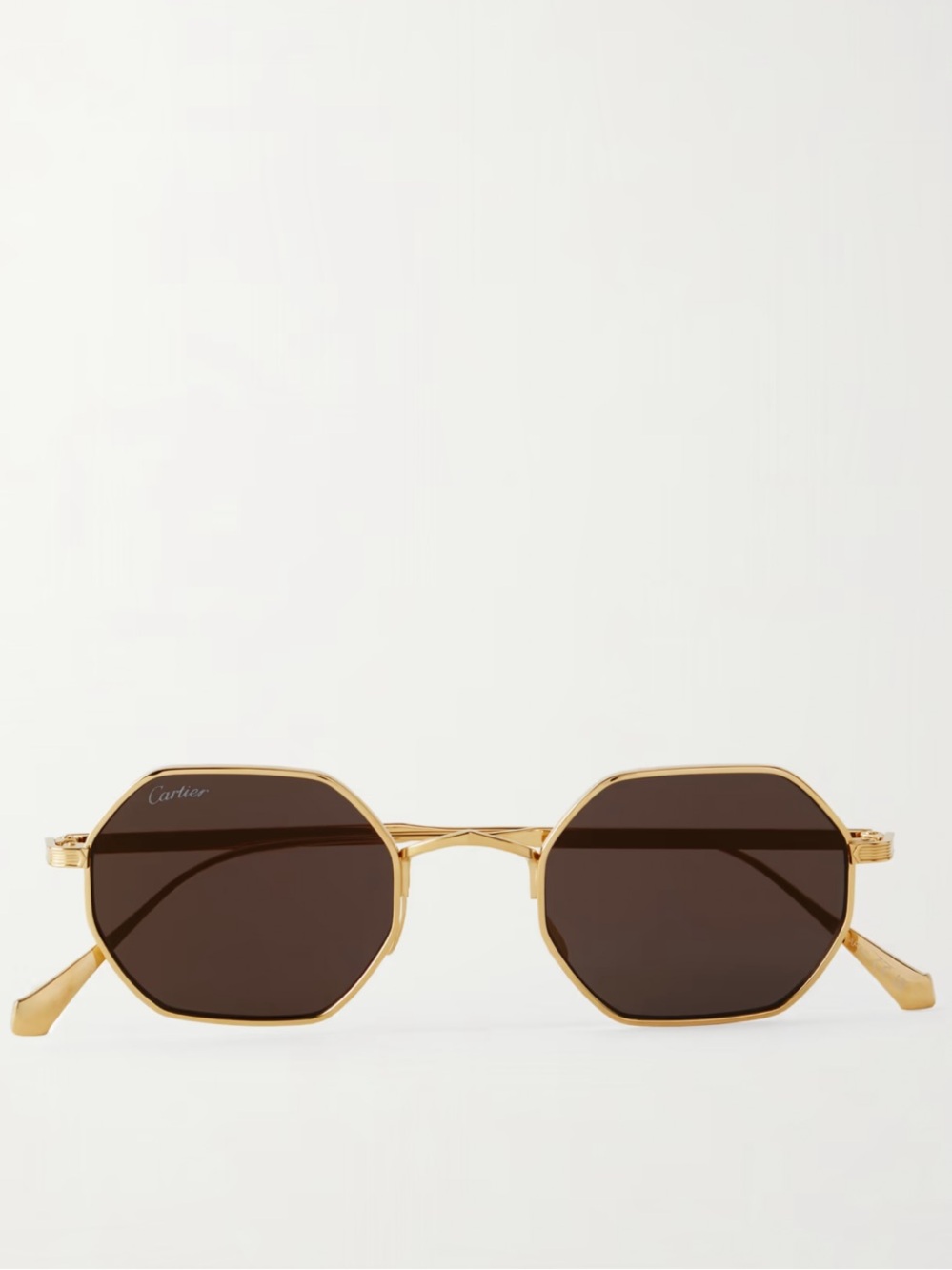 Cartier sunglasses in gold with brown frames.